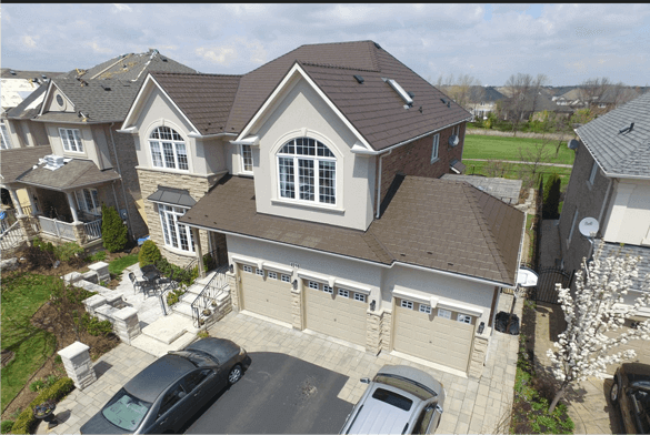 Aerial view of a neighbourhood home with a finished Kodiak metal roof.